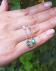 Pear shaped emerald dangle earrings