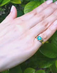 Claddagh emerald ring for women in 14k yellow gold.