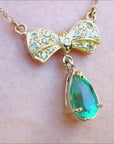 18k Yellow gold emerald bowtie necklace