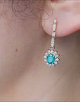 Dangle emerald diamond earrings