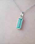 Natural emerald solitaire pendant in white gold