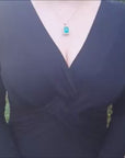 Yellow gold emerald pendant