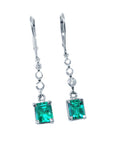 Pair of natural Emerald dangle earrings front side view on a white background