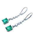 1.55 ct. Colombian emerald dangle earrings with 14K white gold lever backs.