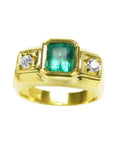 18k yellow gold ring for men with a natural colombian emerald and two side diamonds.