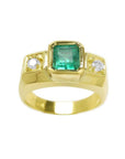 Men's 18K yellow gold ring with a rectangular emerald and two round accent diamonds.