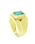 Men's 18K yellow gold solitaire ring with a rectangular Colombian emerald in a full bezel setting.