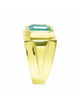 The side profile of this men's emerald solitaire ring displays its topside and profile side of the band design.