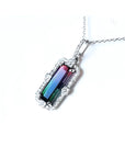 3.50 ct. watermelon tourmaline pendant with diamond halo on an 18K white gold chain.