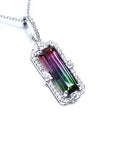 A natural brazilian watermelon tourmaline pendant with white gold and diamonds frame on white background