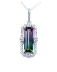 Watermelon tourmaline pendant with diamond halo on an 18K white gold chain.