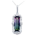 Watermelon tourmaline pendant with diamond halo on an 18K white gold chain.