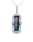 Watermelon tourmaline pendant with diamond halo on an 18K white gold chain.