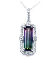 Watermelon tourmaline pendant with diamond halo on an 18K white gold chain.
