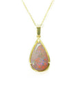 Pear-shaped Australian opal pendant with red/orange fire, set in 14k yellow gold on a delicate chain.