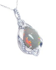 Pear-shaped Welo Ethiopian opal pendant in sterling silver with cubic zirconia accents.