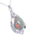 Pear-shaped Welo Ethiopian opal pendant in sterling silver with cubic zirconia accents.