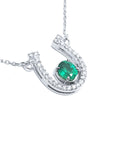 Horseshoe emerald necklace for women crafted in 14k white gold, a lucky piece of jewelry to wear every day