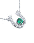 Horseshoe emerald necklace for women crafted in 14k white gold, a lucky piece of jewelry to wear every day