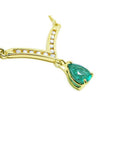1.01 carat pear cut emerald necklace with accent diamonds set in 14K yellow gold.