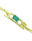 14K yellow gold bracelet with a rectangular Colombian emerald haloed by natural diamonds.
