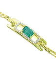 14K yellow gold bracelet with a rectangular Colombian emerald haloed by natural diamonds.