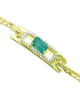 14K yellow gold bracelet with a rectangular Colombian emerald haloed by natural diamonds.