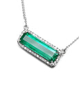 18K white gold necklace with a rectangular Colombian emerald and diamond halo, East-West design.