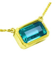 Natural emerald solitaire necklace bezel set east-west orientation handcrafted in 18k yellow gold
