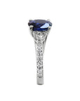 1.84 ct oval blue sapphire ring with side diamonds in 14K white gold.