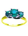 A three stone emerald ring with round cut emeralds, May's birthstone, featuring a combination of white and yellow gold.