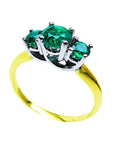 From a partial side angle, this emerald ring reveals the top setting, a portion of the gallery, and the band design.