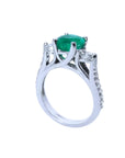 1.38 ct. round emerald three-stone ring with side diamonds in 14K white gold.