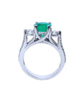 The lateral profile of a round cut emerald ring, displaying top, gallery and band of the ring visibles.