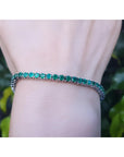 Natural Colombian Emeralds Tennis Bracelet prong set sparkling medium deep green color prong set in individual links.