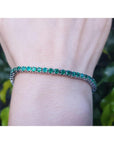 Natural Colombian Emeralds Tennis Bracelet prong set sparkling medium deep green color prong set in individual links.