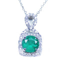 Emerald pendant necklace on a front position topside view.