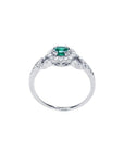 Round cut emerald halo ring with natural diamonds set in 14K white gold.
