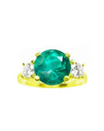 GIA certified F1 round Colombian emerald three-stone ring with accent diamonds in 18K yellow gold.