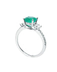 1.10 ct. round Colombian emerald ring with baguette side diamonds on a 14K white gold band.