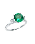 1.10 ct. round Colombian emerald ring with baguette side diamonds in 14K white gold.