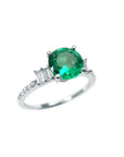 1.10 ct. round Colombian emerald ring with baguette side diamonds in 14K white gold.