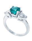 A white gold emerald ring for women on a lateral profile gallery on sight.