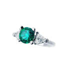 1.00 ct. round emerald ring with trillion side diamonds in 14K white gold.