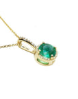 1.80 ct. round natural emerald pendant necklace with halo diamonds in 14K yellow gold.