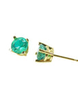 Round natural Colombian emerald stud earrings in 14K gold basket settings with push backs.