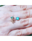 1.09 ct. round natural Colombian emerald stud earrings in 14K gold basket settings with push backs.