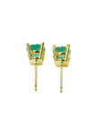 Pair of 1.09 ct. round natural Colombian emerald stud earrings in 14K gold basket settings with push backs.