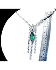 Marquise Colombian emerald and diamond necklace in 14K white gold, shown with a ruler for scale.