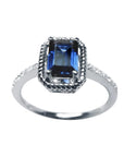 Women's sapphire solitaire ring medium light blue accent diamonds crafted in 14K white gold.